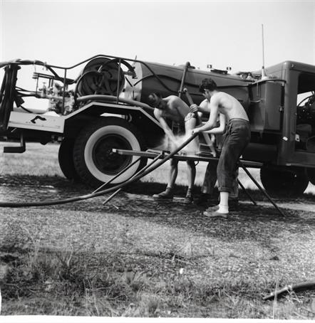 Three man low down pump training at Mt Matha CFA Brigade in the 1960s